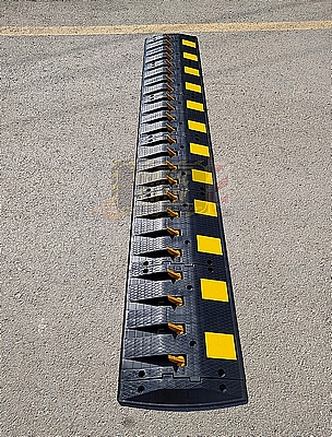 A spike barrier is installed on the road